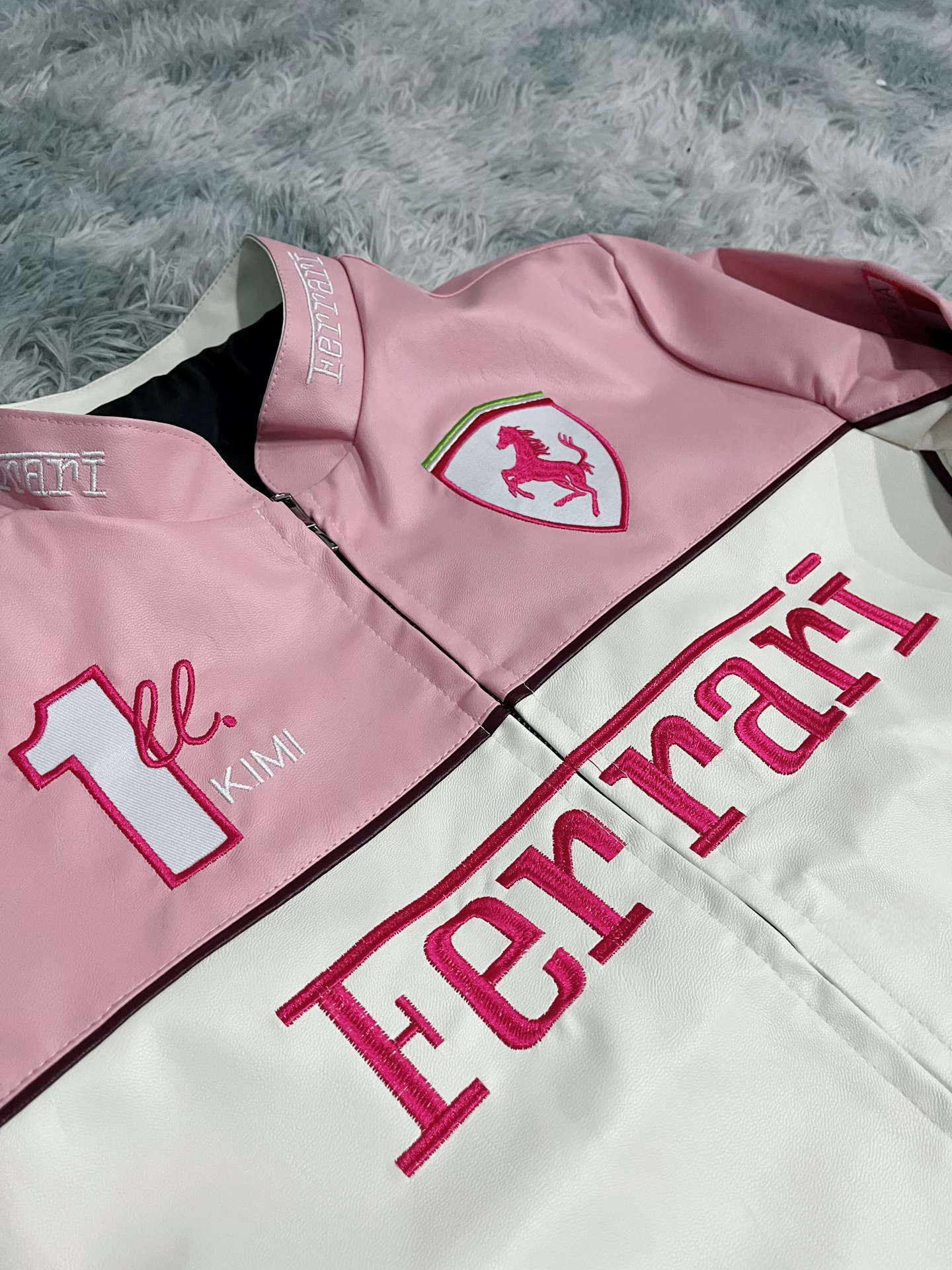 Close-Up of Pink Ferrari Leather Jacket Detailing and Logo Design
