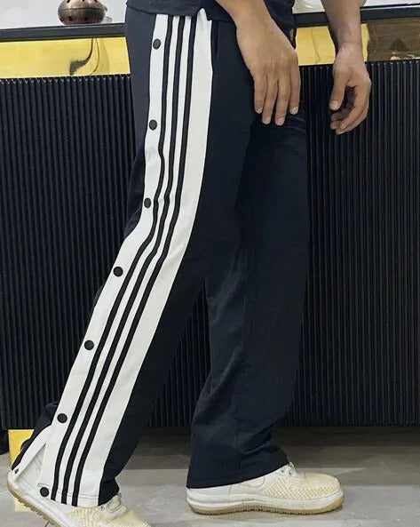 Front view of black snap pants for casual street style