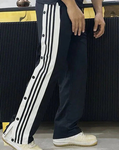 Front view of black snap pants for casual street style