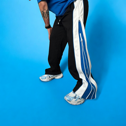 Jipper Baggy Track Pant Wavy zip panels, oversized fit, bold color blocking. The original statement piece.