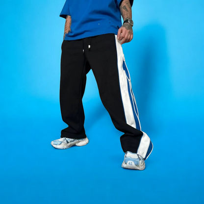 Jipper Baggy Track Pant Wavy zip panels, oversized fit, bold color blocking. The original statement piece.